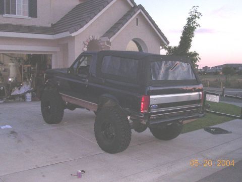 1994 Ford Bronco - This 1994 Ford Bronco is parked in front of a house at dusk.