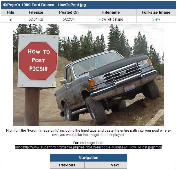 Ford pickup truck tilted on a dirt hill next to a stop sign that says "How TO POST PICS!!!"