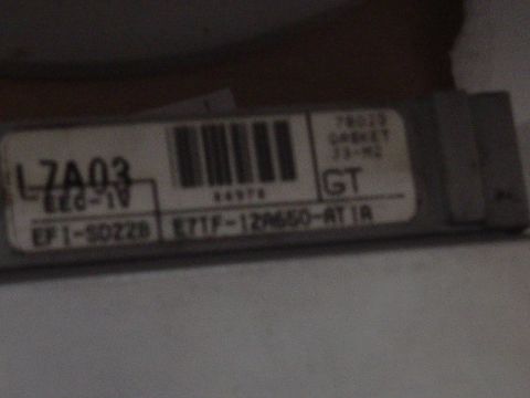 1987 Ford Bronco - Label on an electronic control unit shows part number E71F-12A650-AT1R.