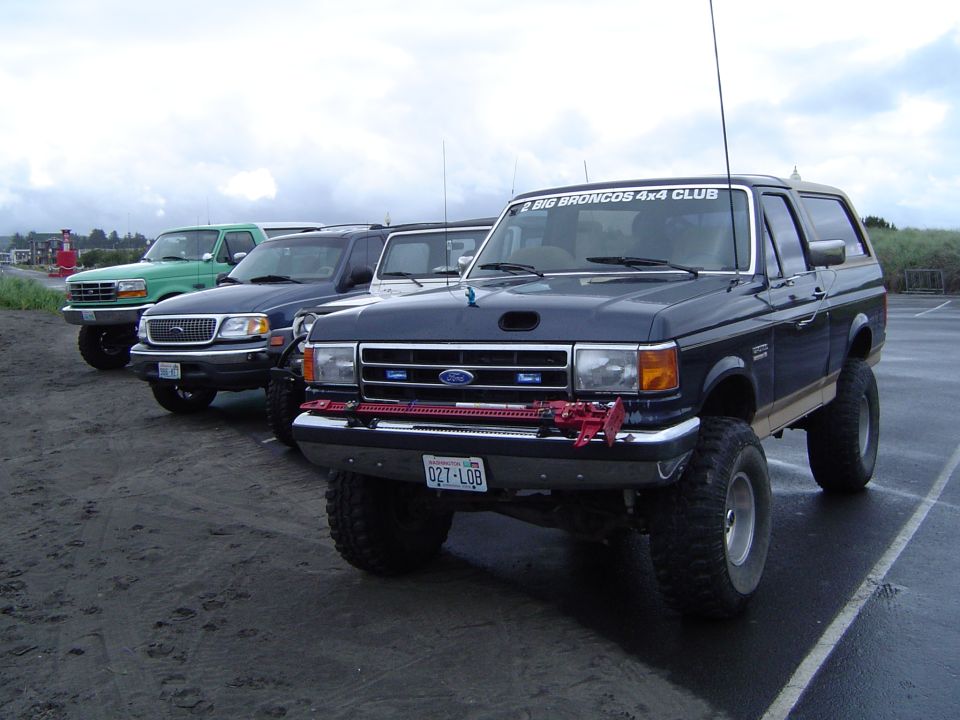 Dark blue 1989 Ford Bronco with off-road tires and "BIG BRONCOS 4x4 CLUB" sticker
