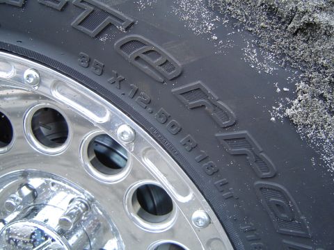 1989 Ford Bronco - BFGoodrich All-Terrain T/A tire and chrome wheel detail, size 35x12.50R18LT.