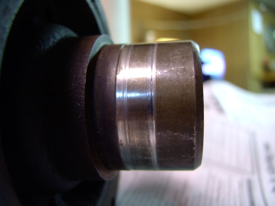19 years and 230,000 + miles and the numerous TC cover seals had worn a groove into the harmonic balancer's snout.  Even a new seal would leak past this groove.