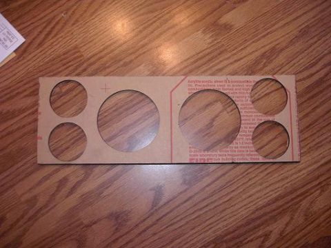 1980 Ford Bronco - Acrylic gauge panel with multiple circular cutouts for instruments.