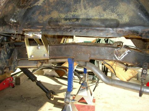 1995 Ford Bronco - Vehicle frame and suspension components are shown during a repair or modification.