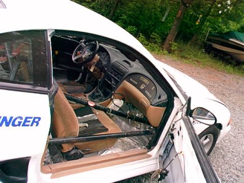 1995 Ford Mustang - Interior view of a 1995 Ford Mustang Cobra R, showing racing modifications and dashboard details.