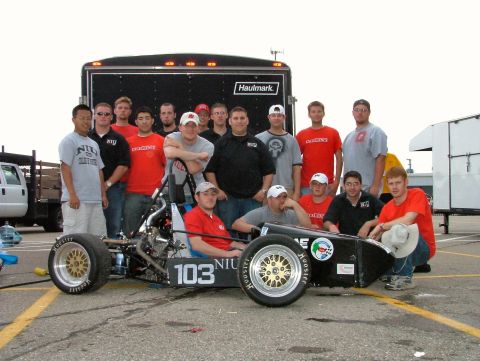 1985 Ford LTD Crown Victoria - An NIU Formula SAE open-wheel race car, number 103, sits on a parking lot on Hoosier racing slicks with a mid-mounted engine exposed, as a…