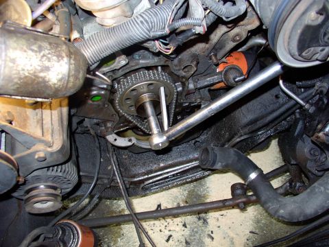1986 Ford Bronco - Torquing the cam bolt often requires jamming in a punch, shown here, to tighten against.