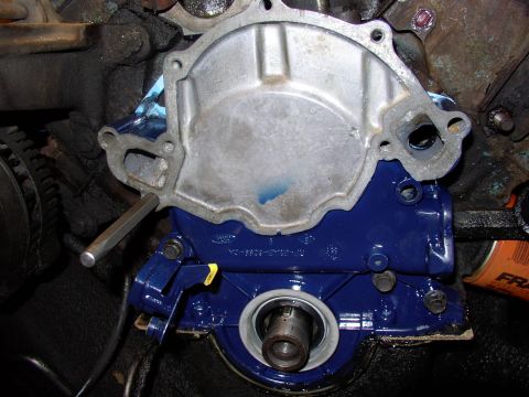 1986 Ford Bronco - Slip in the two lowest bolts a few threads then lever the case down with the punch and draw it onto the block dowels by tightening the bolt…