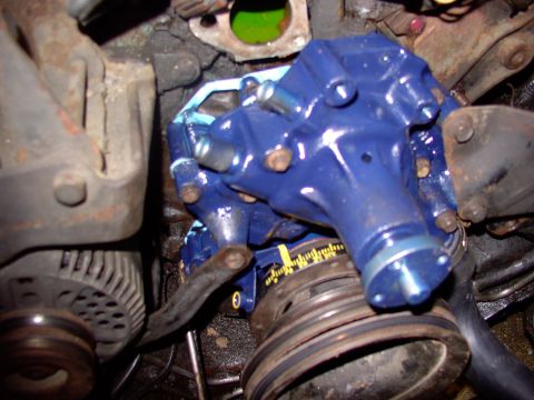 1986 Ford Bronco - Several bolts pass through the water pump first and then the TC cover, so be prepared to bolt on the pump right after you get the cover on.…