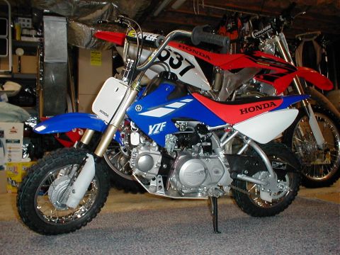 1995 Ford Bronco - newwest mods include 7" raised handlebar kit, blue plastic, custom graphics, & heavy duty front & rear springs.