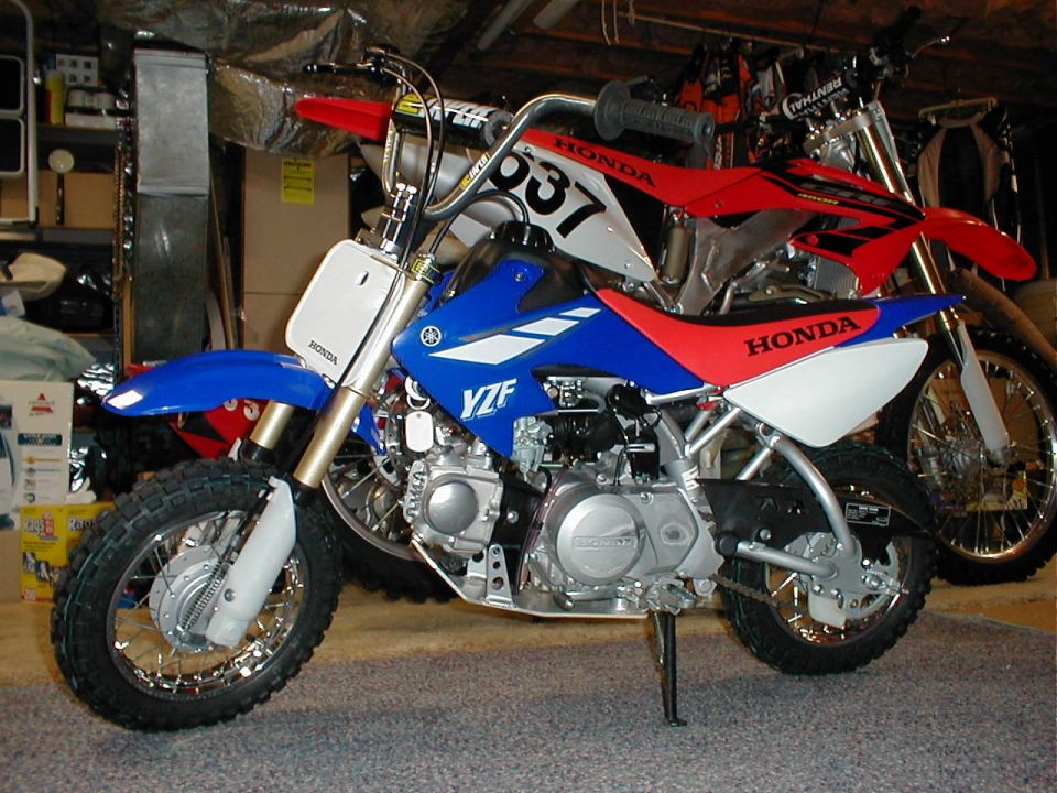 newwest mods include 7" raised handlebar kit, blue plastic, custom graphics, & heavy duty front & rear springs.
