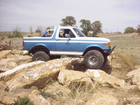 1988 Ford Bronco - This Ford Bronco is equipped for off-road adventures, tackling a rocky terrain.