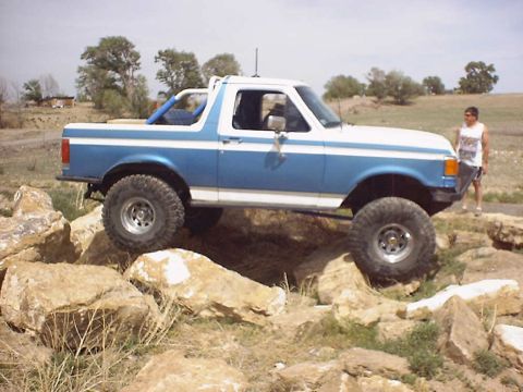 1988 Ford Bronco - This lifted 1987 Ford Bronco navigates a challenging rocky obstacle course.
