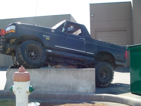 1993 Ford Bronco - This 1993 Ford Bronco is positioned on a concrete structure, its off-road tires.