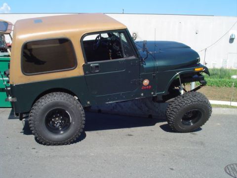1993 Ford Bronco - This modified Jeep CJ-7 features a two-tone paint scheme and off-road tires.