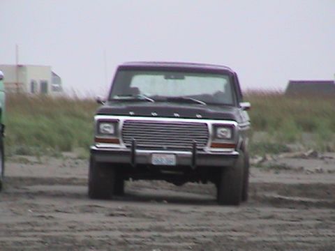 1994 Ford Explorer - This black Ford pickup truck appears to be a 1979 model, seen here on a sandy area.