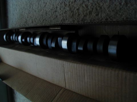 1988 Ford Bronco - Camshaft part shown inside a cardboard box.