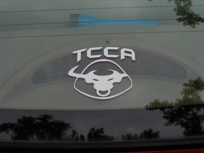 1997 Ford Taurus - A decal with a bull logo and 'TCCA' text is visible on the rear window of a vehicle.
