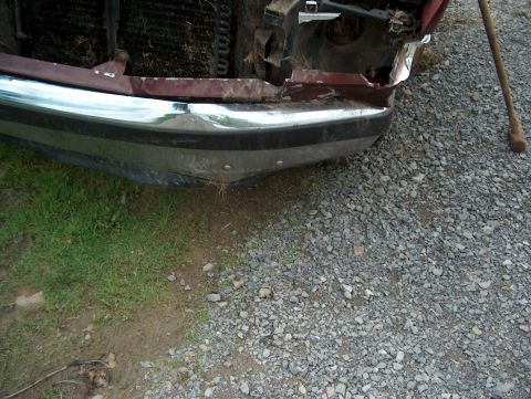 1990 Ford F-150 - Front view of a damaged 1990 Ford F-150, showing the bumper and grille area.
