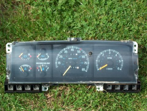 1990 Ford F-150 - Instrument cluster from a 1990 Ford F-150, showing gauges for speed, RPM, fuel, and temperature.
