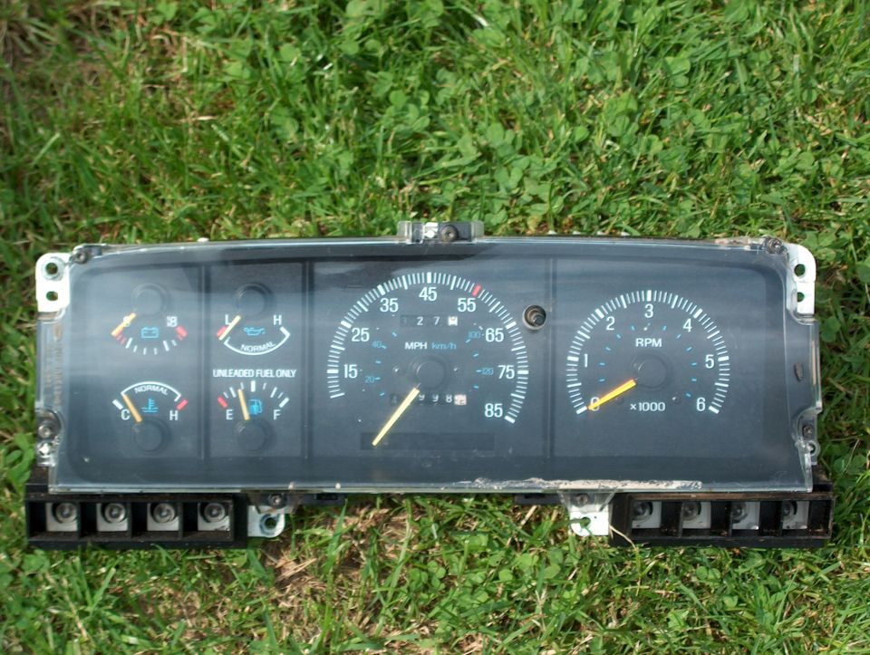 1990 Ford F-150 instrument cluster with speedometer, tachometer, fuel, oil, and temperature gauges