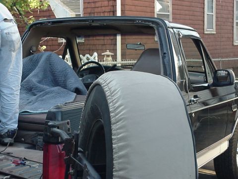 1993 Ford Bronco - Interior view of a 1993 Ford Bronco, showing the spare tire and part of the cabin.