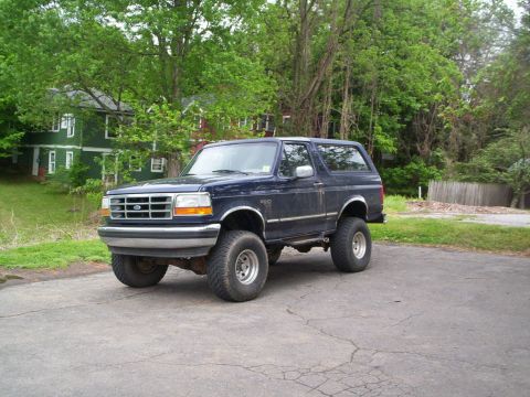 1994 Ford Bronco - This 1994 Ford Bronco is shown from a 3/4 front angle, parked outdoors.