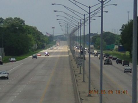1984 Chevrolet Blazer - A view of highway traffic with numerous vehicles and streetlights lining the road.