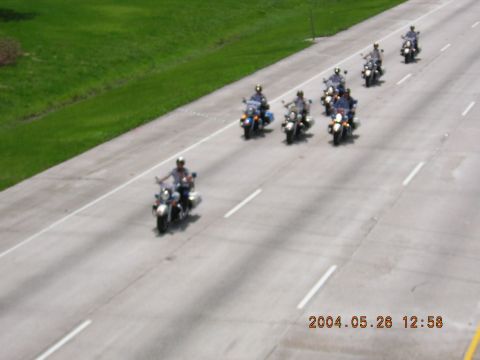 1984 Chevrolet Blazer - A group of motorcycles rides in procession on a highway, captured on May 28, 2004.