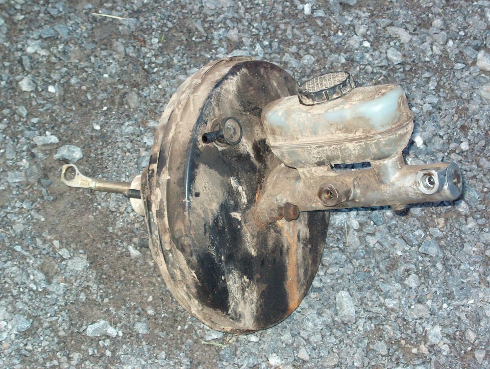 Brake booster and master cylinder assembly on gravel