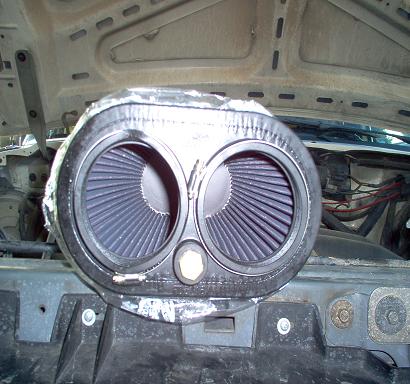 1988 Ford Bronco - Custom dual air intake assembly installed in the engine compartment of a vehicle.