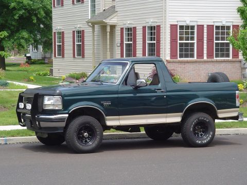 1993 Ford Bronco - 1993 Ford Bronco parked in front of a house.