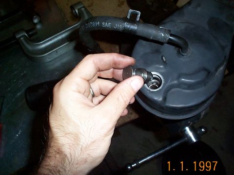 1992 Ford Bronco - Reinsert the flow valve. It has been said you shouldn't reuse the flow valve. I cleaned mine of with carb cleaner and it was good to go.