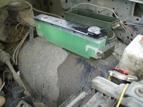 1981 Ford Bronco - bent the other bracket to contour the fender and riveted it in place. installed the 2 bolts hoooked up the power connector and the hose for…