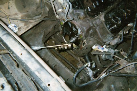 1978 Ford Bronco - Close-up view of an engine's internal components, focusing on the camshaft area during a repair or rebuild.