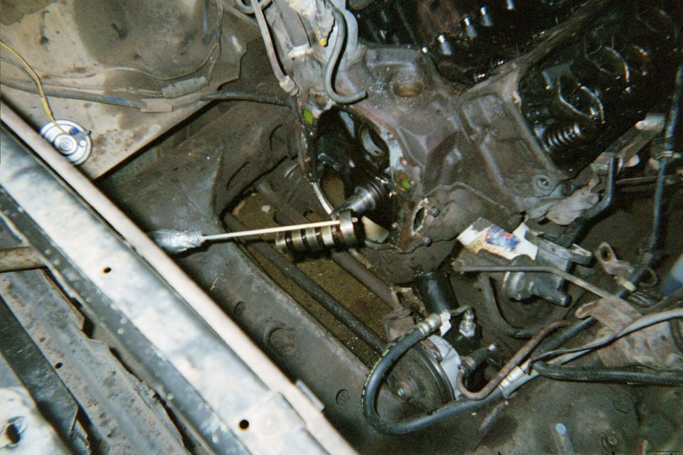Engine block with camshaft removed, showing internal components and some wiring
