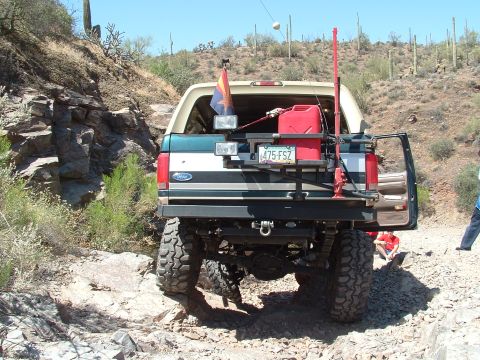 1990 Ford Bronco - This modified Ford Bronco navigates a rocky desert trail.