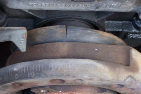 1986 Ford Bronco - Close-up of a vehicle's engine harmonic balancer, showing timing marks and a 'TIME' indicator.