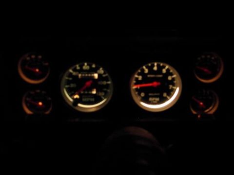 1980 Ford Bronco - The illuminated dashboard gauges display speed, RPM, and other vital information in the dark.