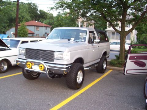 1990 Ford Bronco - This lifted 1990 Ford Bronco features a custom front bumper with unique smiley face lights.