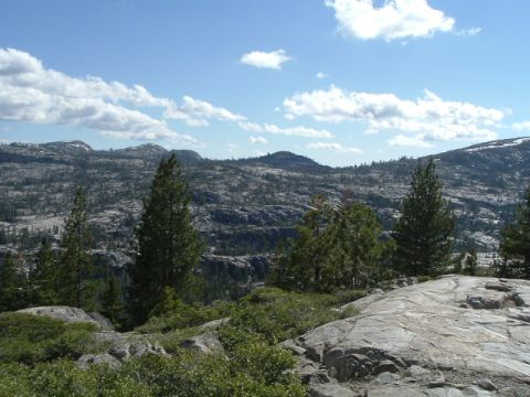 1989 Ford Bronco - A scenic view of a mountainous region with sparse vegetation and a clear sky.