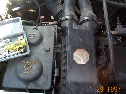 1992 Ford Bronco - To install the pump, remove the tubes from the airbox to the throttle body, this will allow access to the top A/C compressor.
