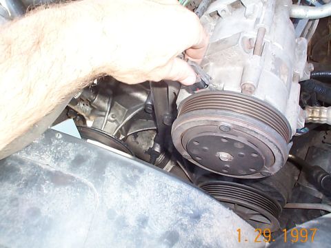 1992 Ford Bronco - Unplug the A/C harness, and move it out of the way, you don't want to risk ripping it off.
