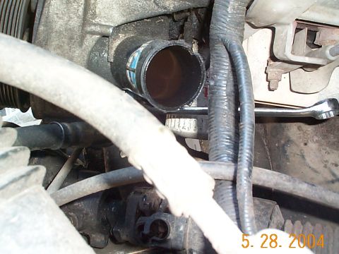 1992 Ford Bronco - It's a tight fit, but you'll be able to get a wrench in there to take the pressure fitting off.