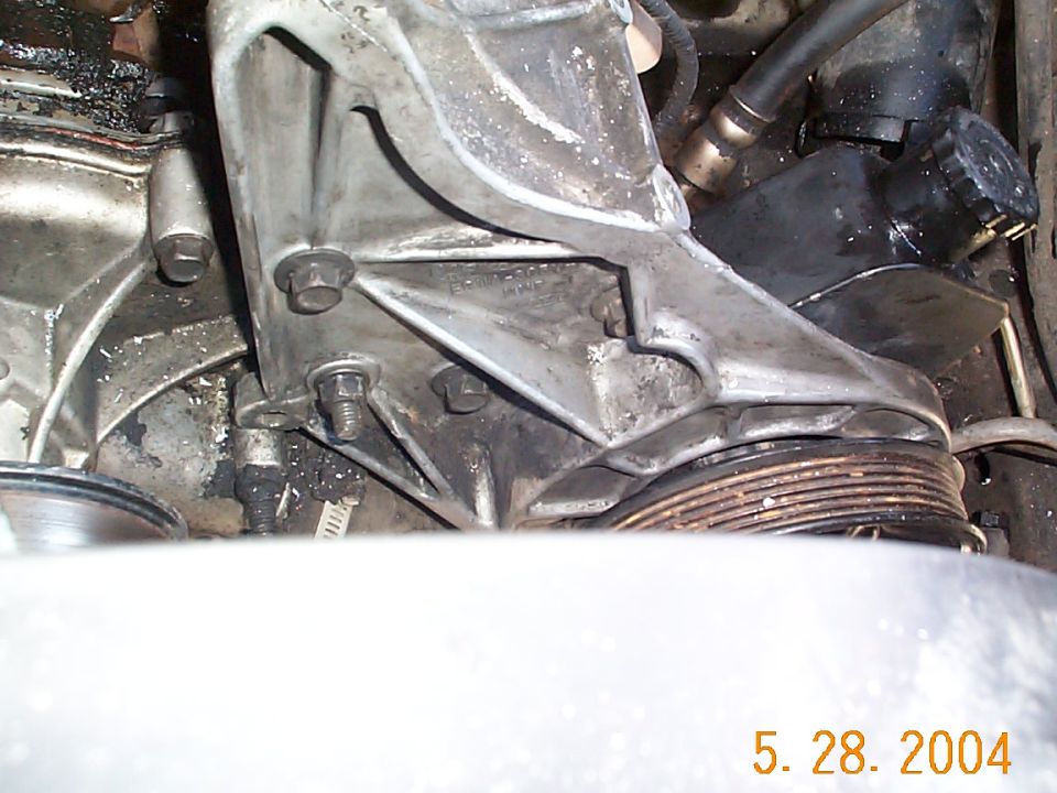 Reinstall the bolts on the front of the bracket.