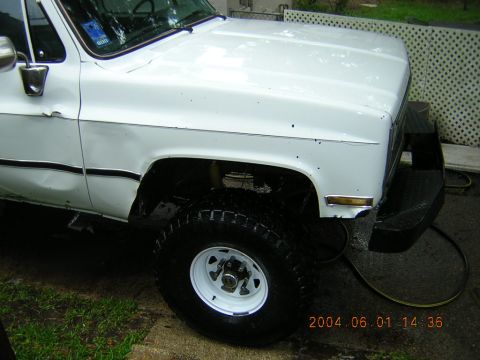 1984 Chevrolet Blazer - Front quarter view of a white 1984 Chevrolet K5 Blazer with off-road tires and a custom bumper.