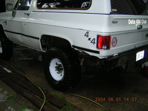 1984 Chevrolet Blazer - Rear view of a white Chevrolet K5 Blazer, "4x4" decals and "Delta 4x4 Club" text on the tailgate.