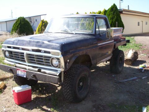 1978 Ford Bronco - This 1975 Ford F-Series pickup truck features a flatbed and lifted suspension.