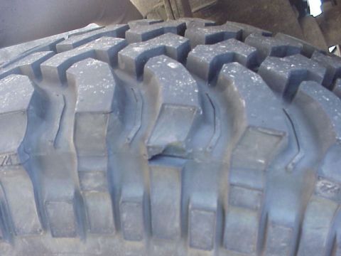 1989 Ford Bronco - Detail of a off-road tire tread, suggesting off-road use.