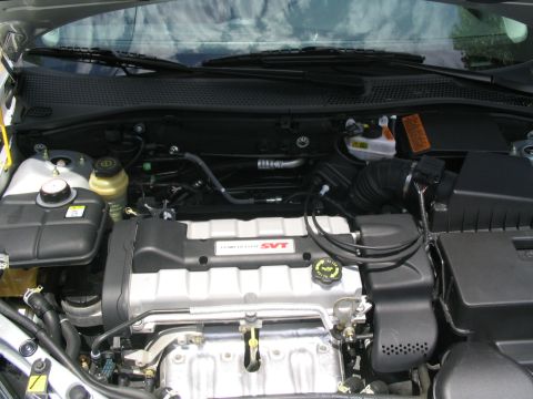 2003 Ford Focus - Engine bay of a 2003 Ford Focus SVT, showing the "SVT" branding on the engine cover.
